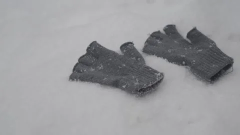 Lost gloves on snowy ground in winter Stock Footage 333166241