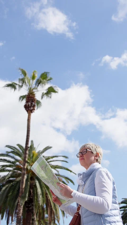 Lost mature tourist using a map Stock Footage 270207382