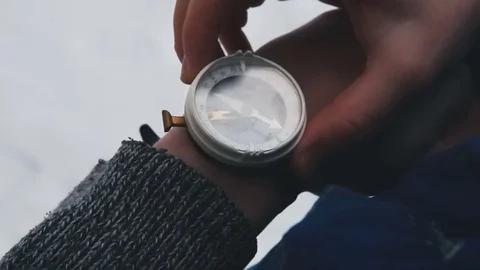 Lost person checks the compass Stock Footage