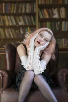 Lost in though in library Stock Photos