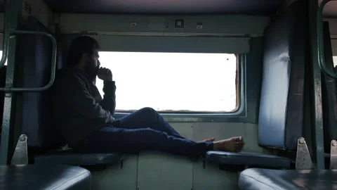 Lost in thoughts. indian young bearded man sitting, traveling alone &amp; thinkin Stock Footage 167449679
