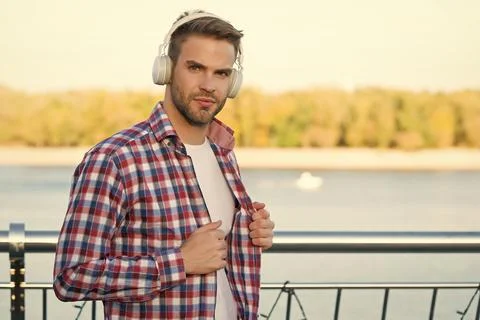 Lost in thoughts. listen to music. guy casual style listening ebook. audio book Stock Photos
