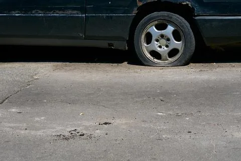 Lost in time. The rear wheel of an old car Stock Photos