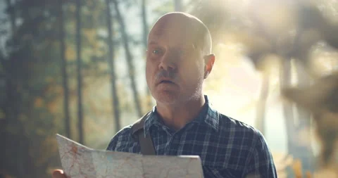 Lost tourist checking his location on a map Video stock 151158680