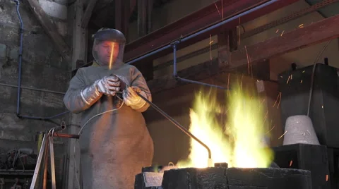 Lost wax bronze casting in a foundry Stock Footage 60032696