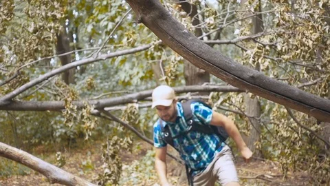 Lost Young Man Looking For Direction In The Forest. Slow Motion. Stock Footage