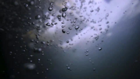 A lot of air bubbles rise to the surface of the water in slow motion. Stock Footage 150765243