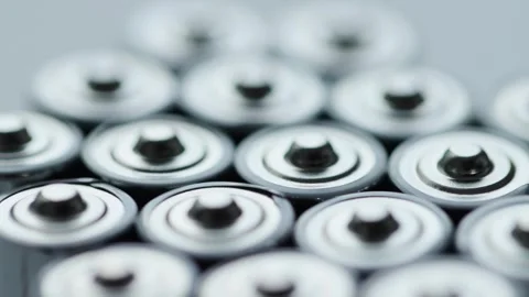 A lot of alkaline charged batteries with different polarity and power. Battery Video stock 252873980