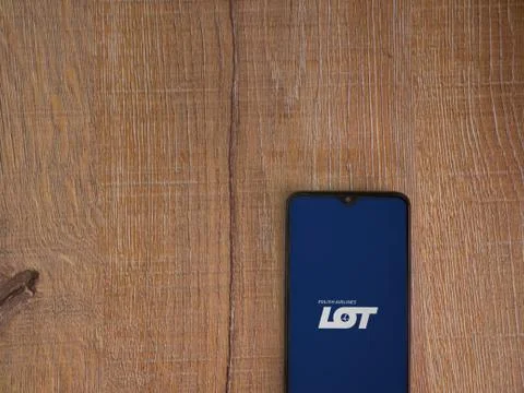 LOT app launch screen with logo on the display of a black mobile smartphone o Stock Photos