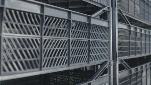 A lot of  black plastic boxes on the production storage fruit 스톡 동영상 123428002