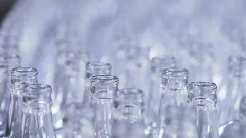 Lot of bottles are conveyed by auto transporter. Automatic mill complex for maki Stock Footage 199489853