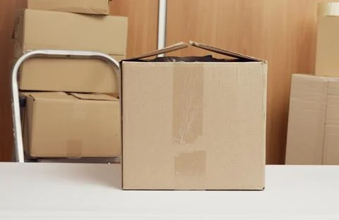 Lot of brown cardboard boxes, the process of packing things when moving Photos