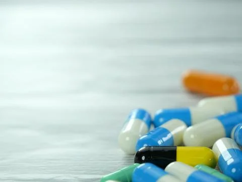A lot of capsules on a white-gray background with copy space. Stock Photos