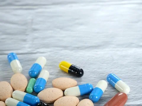 A lot of capsules on a white-gray background with copy space. Stock Photos