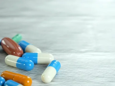 A lot of capsules on a white-gray background with copy space. Stock Photos