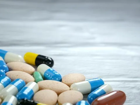 A lot of capsules on a white-gray background with copy space. Stock Photos