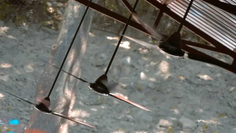 A lot of ceiling fans under a canopy in the street of India rotate and cool  Stock Footage 108123793