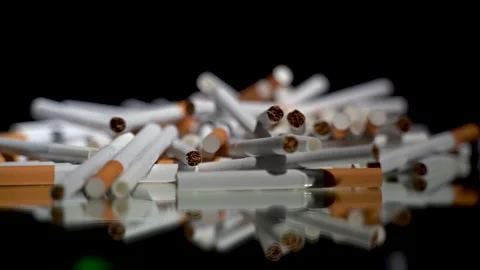 A lot of cigarettes in bulk on a rotating table Stock Footage 256016025