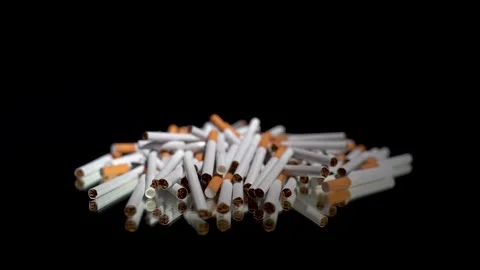 A lot of cigarettes in bulk on a rotating table Stock Footage 256016602