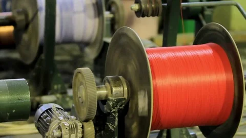 A lot of coils with multi-colored cables twisting factory Video stock 76951076