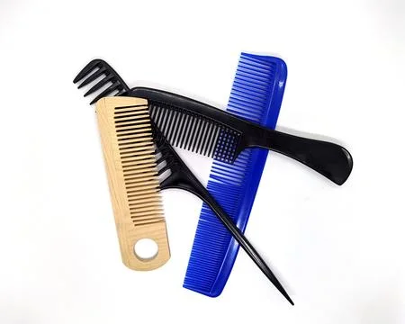 Lot of combs on a white background. Stock Photos