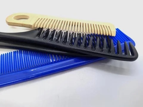 Lot of combs on a white background. Stock Photos