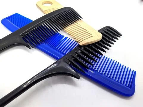 Lot of combs on a white background. Stock Photos