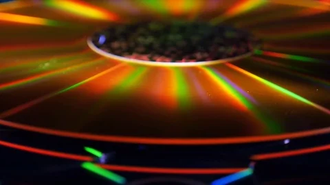 A lot compact discs lying close to a large gold laser disc rotation 스톡 동영상 82709869