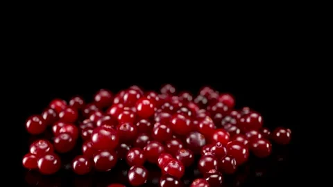 A lot of cranberries close up on a black background Stock Footage 148425115