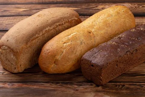 A Lot of different bread closeup. white, black, gray bread Stock Photos