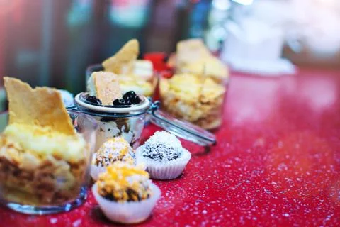 A lot of different desserts on the red table Stock Photos