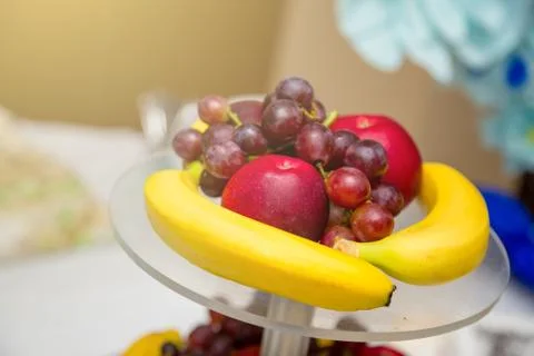 Lot of different fruit on the table. Wedding table decoration in restaurant Stock Photos