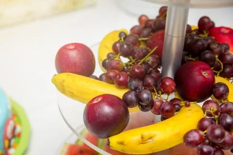 Lot of different fruit on the table. Wedding table decoration in restaurant Stock Photos