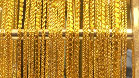 A lot of different gold chains in the shop window Stock Footage 86199246
