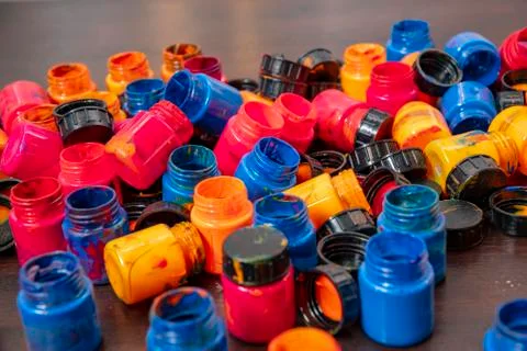 A lot of different paint cans opened on a mountain Stock Photos