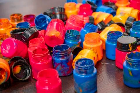 A lot of different paint cans opened on a mountain Stock Photos