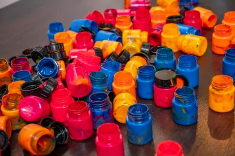 A lot of different paint cans opened on a mountain Stock Photos