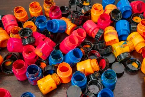 A lot of different paint cans opened on a mountain Stock Photos