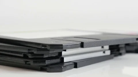 Lot of diskette data archives stacked Stock Footage 75770518