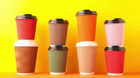 A lot of disposable cups for coffee and tea change places.  Stock Footage 138202660