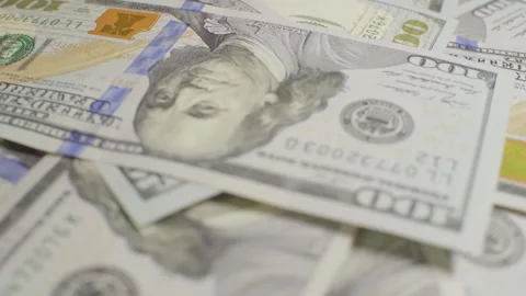 A lot of dollars, close-up. Dollars with a portrait of Franklin Stock Footage 135553309