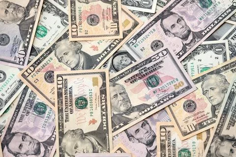 Lot of dollars close up. Stack of dollars and cash with a money background Stock Photos