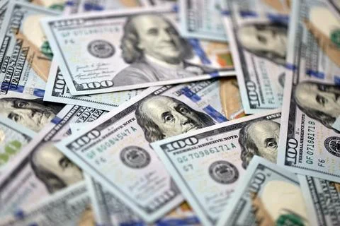 Lot of dollars close up. Stack of dollars and cash with a money background Foto stock