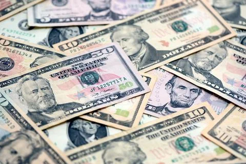 Lot of dollars close up. Stack of dollars and cash with a money background Foto stock
