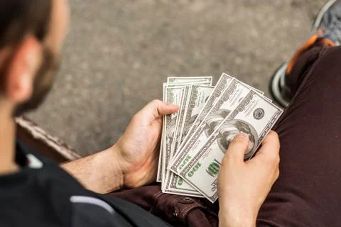 A lot of dollars in the hands Stock Photos