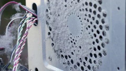 A lot of dust on the computer case fan grille Stockbeeldmateriaal 199063235