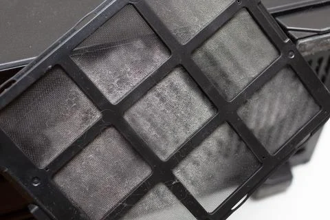 Lot of dust on the computer filter. Dust protection. House, office and apartment Stock Photos