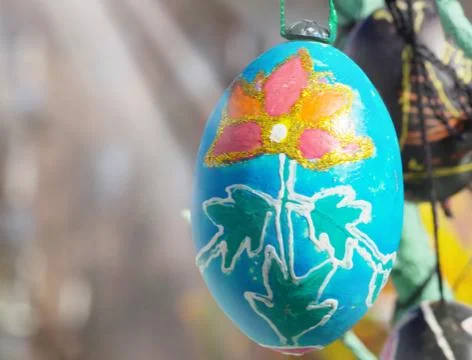 A lot of Easter eggs decorated on tree at spring sunny day Stock Photos