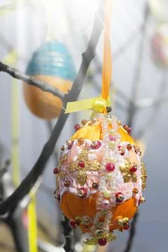 A lot of Easter eggs decorated on tree at spring sunny day Stock Photos