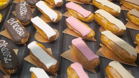 A lot of eclairs on the store shelf. Dessert Stock Footage 265025870